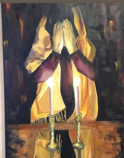 Jewish Woman Lighting Shabbat Candles